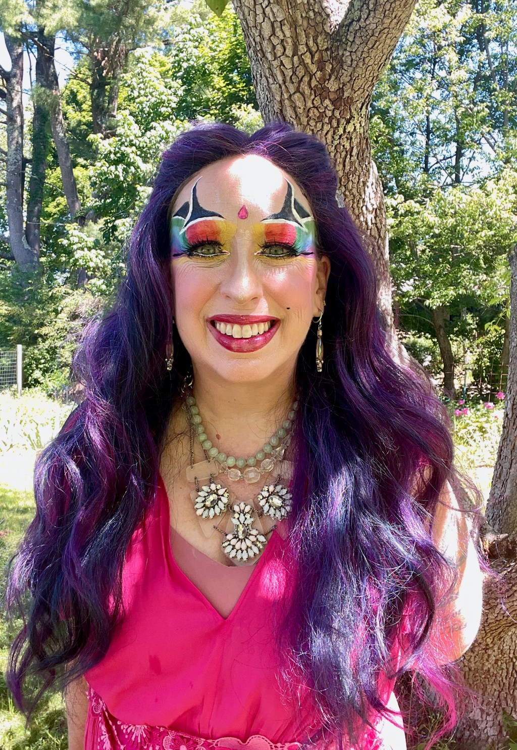 Cartier the Queen looking like a Fairy of Pride standing by her favorite tree.